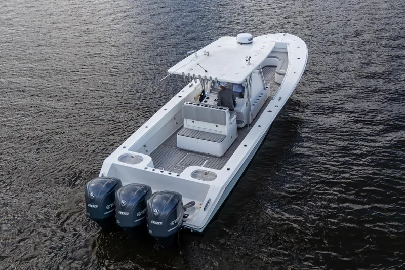  Yacht Photos Pics 2015 SeaHunter 37 Tournament boat with triple outboard engines on open water.