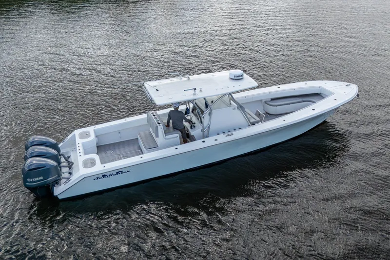  Yacht Photos Pics 2015 SeaHunter 37 Tournament boat on water, featuring triple Yamaha engines.