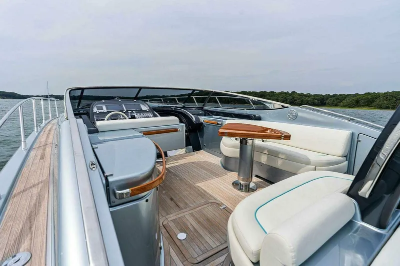  Yacht Photos Pics Luxurious 2016 Riva 52' Rivale yacht interior with elegant seating and wooden accents.