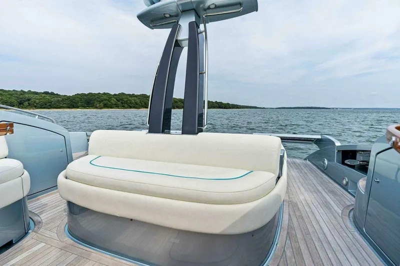  Yacht Photos Pics Luxurious 2016 Riva 52' Rivale yacht with elegant seating, cruising on serene waters.