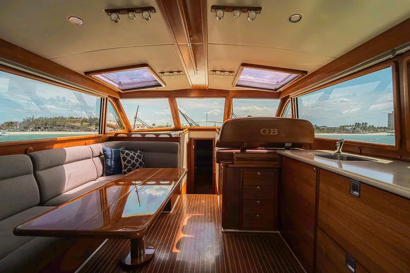 Compass Yacht Photos Pics Luxurious interior of 2020 Grand Banks 44 Eastbay SX yacht with elegant wood finishes.