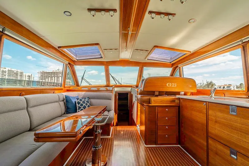 Compass Yacht Photos Pics Luxurious interior of 2020 Grand Banks 44 Eastbay SX yacht with elegant wood finishes.