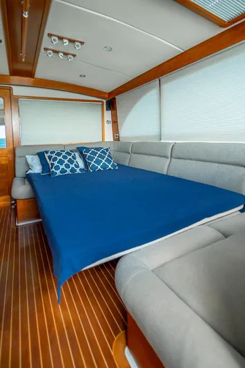 Compass Yacht Photos Pics Interior of 2020 Grand Banks 44 Eastbay SX with cozy bed and elegant wood finish.
