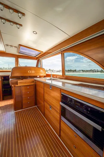 Compass Yacht Photos Pics 2020 Grand Banks 44 Eastbay SX interior with wood finish and ocean view.