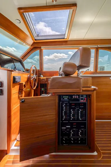 Compass Yacht Photos Pics 2020 Grand Banks 44 Eastbay SX helm with wooden interior and control panel.