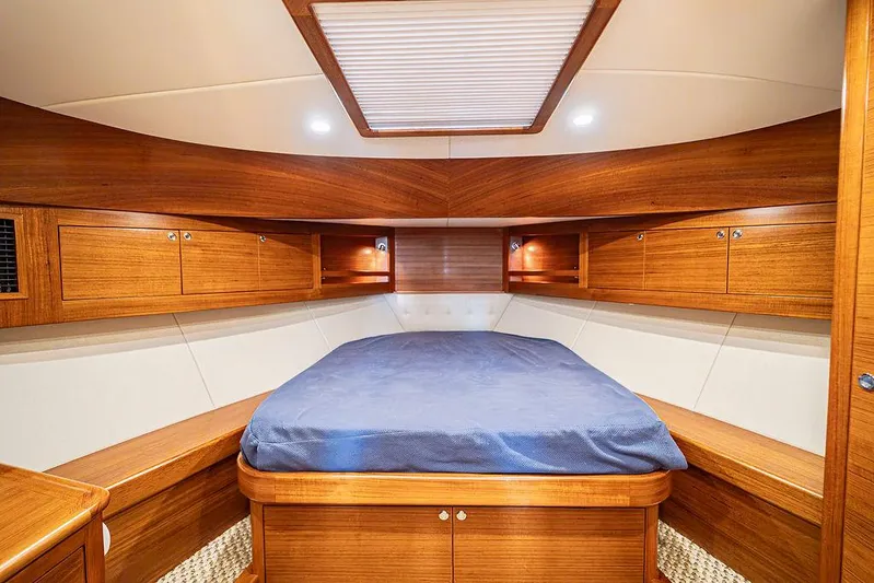 Compass Yacht Photos Pics Luxurious cabin interior of 2020 Grand Banks 44 Eastbay SX yacht with wood finish.