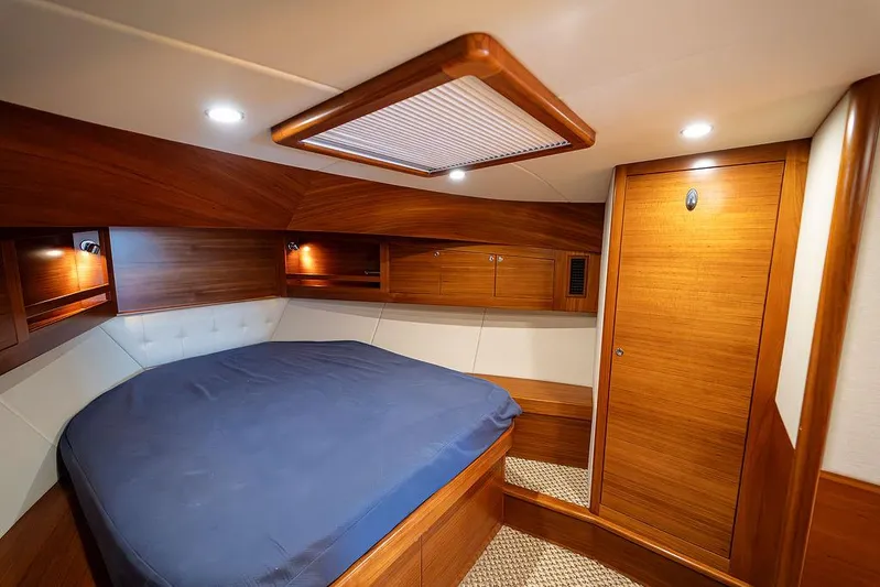 Compass Yacht Photos Pics Luxurious cabin interior of 2020 Grand Banks 44 Eastbay SX yacht with wood finish.