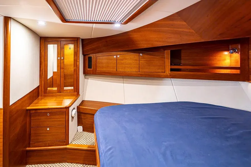 Compass Yacht Photos Pics Luxurious cabin interior of 2020 Grand Banks 44 Eastbay SX yacht with wooden finish.