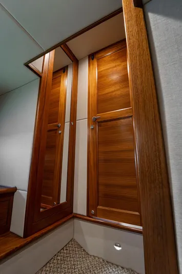 Compass Yacht Photos Pics Luxurious wooden interior of 2020 Grand Banks 44 Eastbay SX yacht cabin.