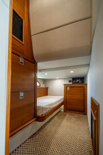 Compass Yacht Photos Pics 2020 Grand Banks 44 Eastbay SX cabin interior with wood accents and cozy bed.