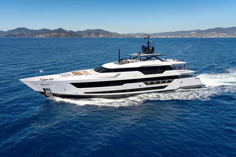 Miotu Yacht Photos Pics Luxurious 2022 Custom Line CL 140 yacht cruising on open sea with scenic coastline.