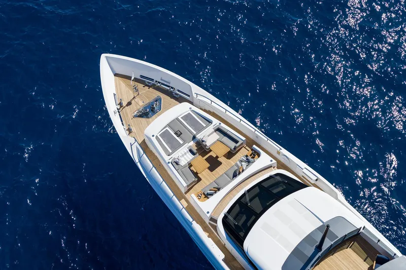 Miotu Yacht Photos Pics Aerial view of 2022 Custom Line CL 140 yacht on sparkling blue water.