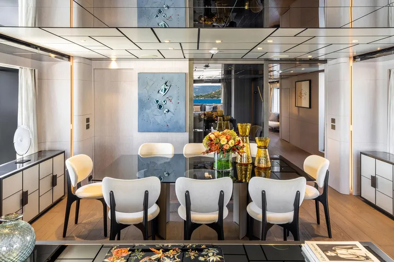 Miotu Yacht Photos Pics Luxurious dining area on 2022 Custom Line CL 140 yacht with elegant decor and modern furnishings.