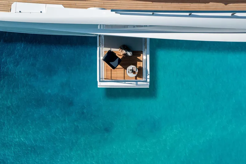 Miotu Yacht Photos Pics Aerial view of Custom Line CL 140 yacht deck over turquoise water, 2022 model.