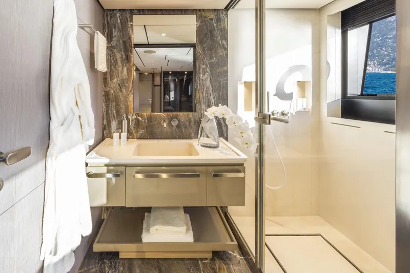 Miotu Yacht Photos Pics Luxurious 2022 Custom Line CL 140 yacht bathroom with elegant marble and ocean view.