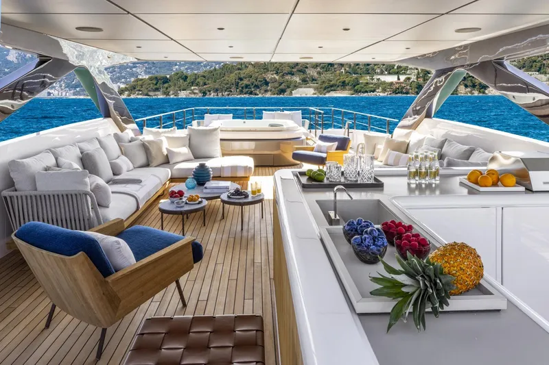 Miotu Yacht Photos Pics Luxurious 2022 Custom Line CL 140 yacht deck with elegant seating and ocean view.