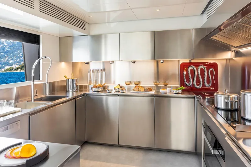 Miotu Yacht Photos Pics Modern stainless steel kitchen on Custom Line CL 140 yacht, 2022 model, with ocean view.