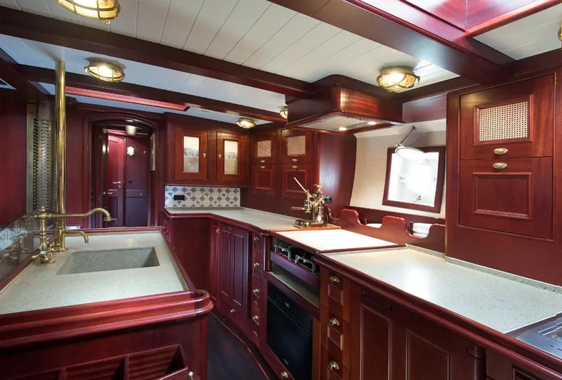 Spirit Of Venice Yacht Photos Pics Luxurious 2018 Olivier Van Meer Custom yacht kitchen with rich wood cabinetry and modern amenities.