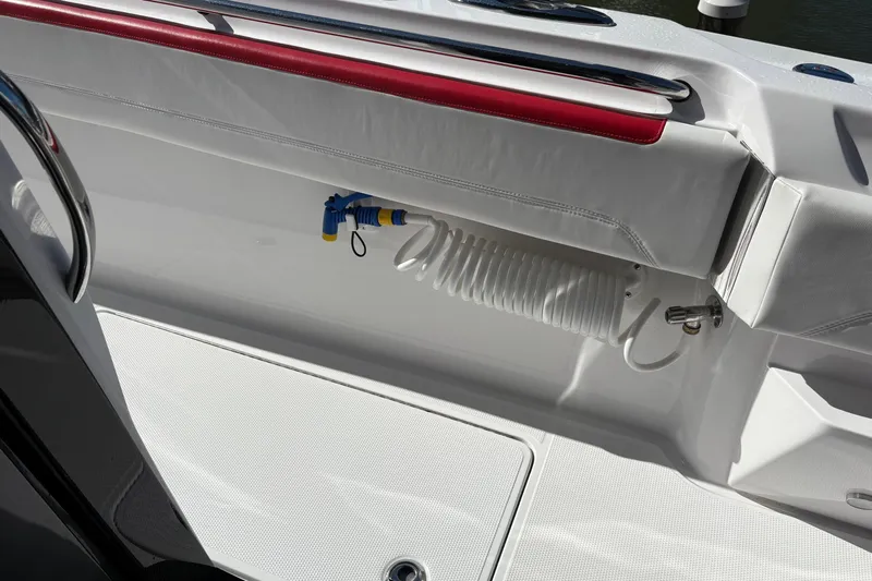  Yacht Photos Pics 2022 Nor-Tech 452 Super Fish boat deck with coiled hose and seating.