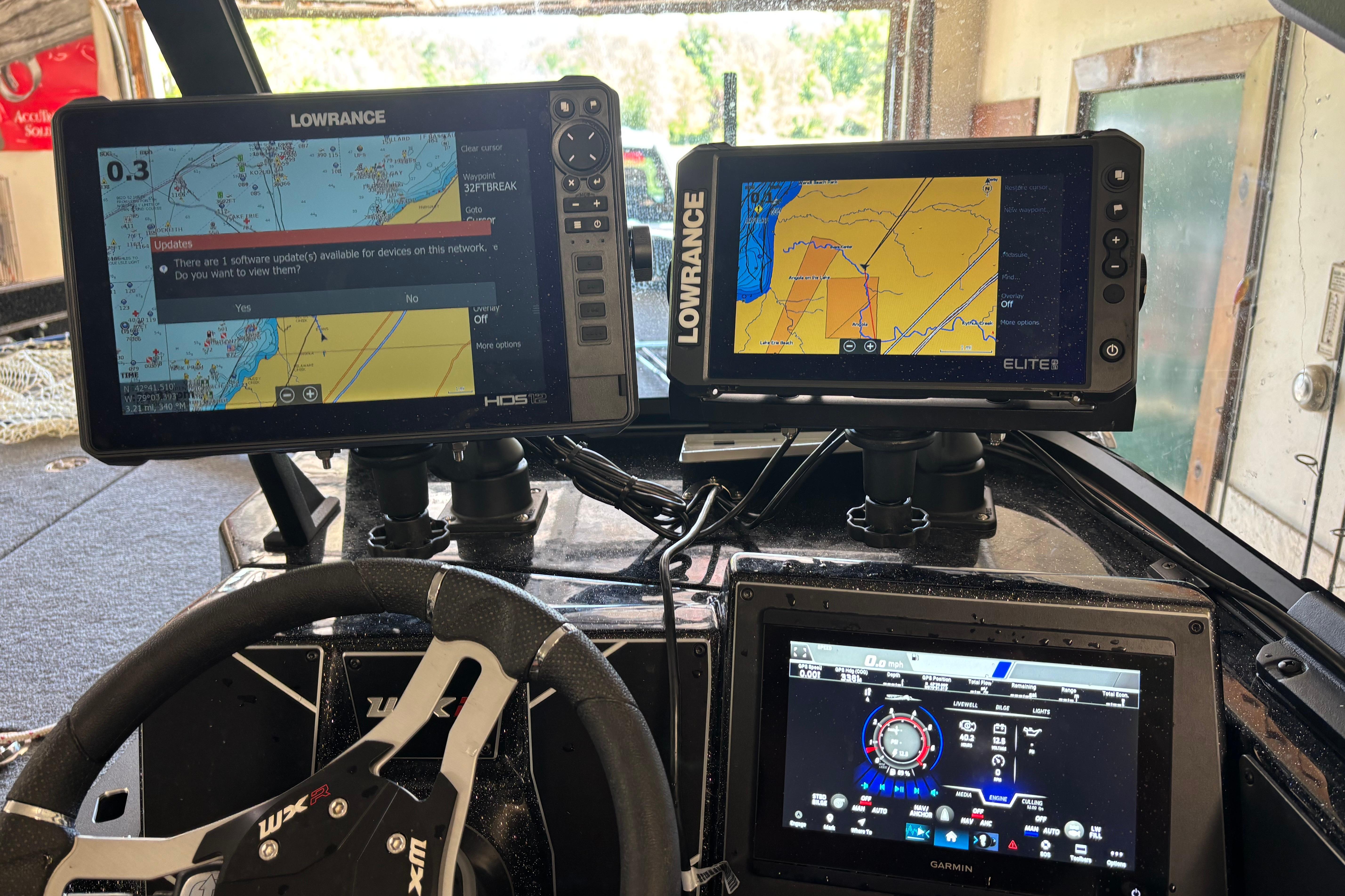 Dashboard of a 2025 Skeeter WXR2260 with Lowrance and Garmin navigation displays.