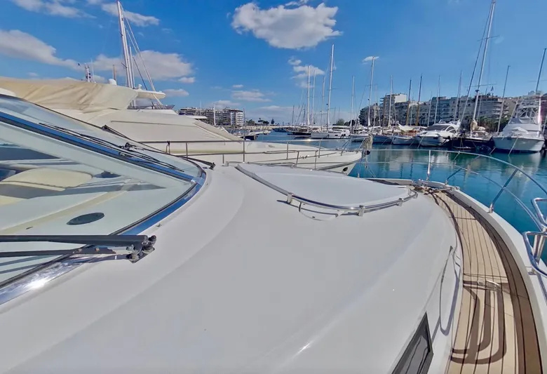  Yacht Photos Pics Fairline Squadron 52 yacht from 2000 docked in a marina under a clear blue sky.