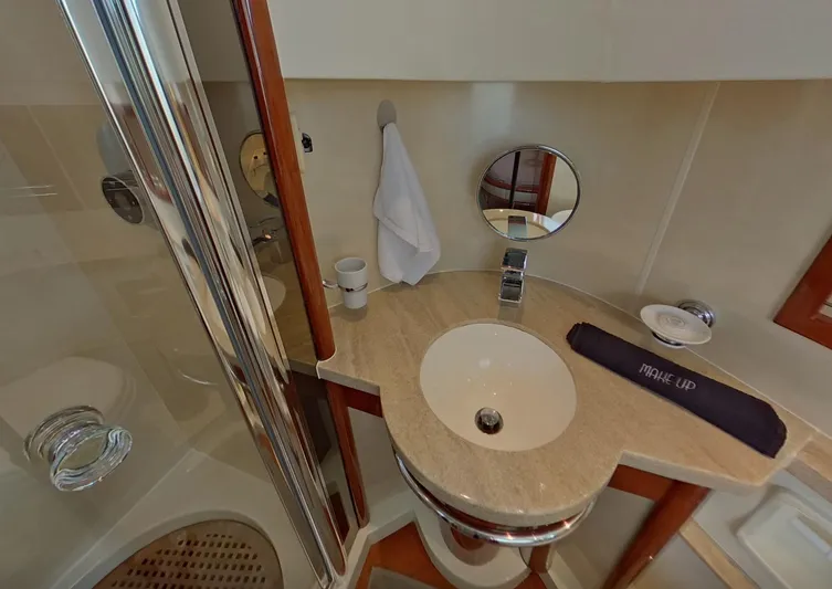  Yacht Photos Pics Luxurious bathroom in 2000 Fairline Squadron 52 yacht with modern sink and shower.
