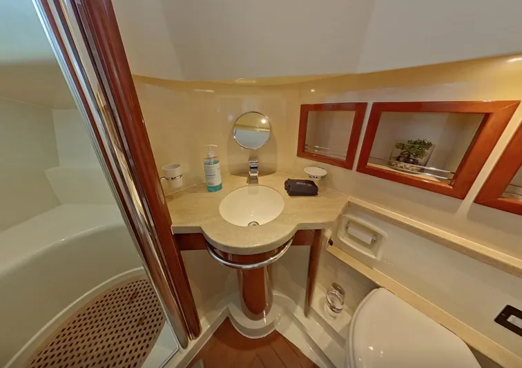  Yacht Photos Pics Luxurious bathroom in 2000 Fairline Squadron 52 yacht with modern fixtures and elegant design.