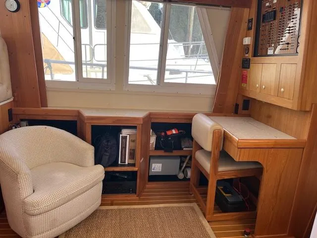  Yacht Photos Pics Interior of 2000 Mainship 430 Trawler with chair, desk, and control panel.
