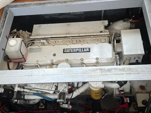  Yacht Photos Pics Engine compartment of a 2000 Mainship 430 Trawler featuring a Caterpillar engine.