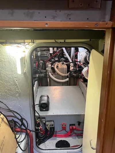  Yacht Photos Pics Engine room of 2000 Mainship 430 Trawler with visible machinery and wiring.