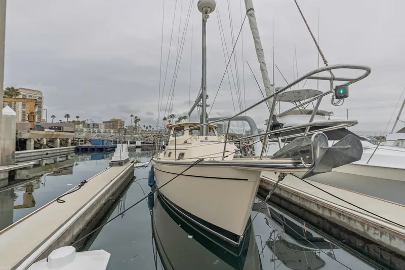 Seeker Yacht Photos Pics 2007 Island Packet SP Cruiser docked in a marina, showcasing its sleek design and sturdy build.
