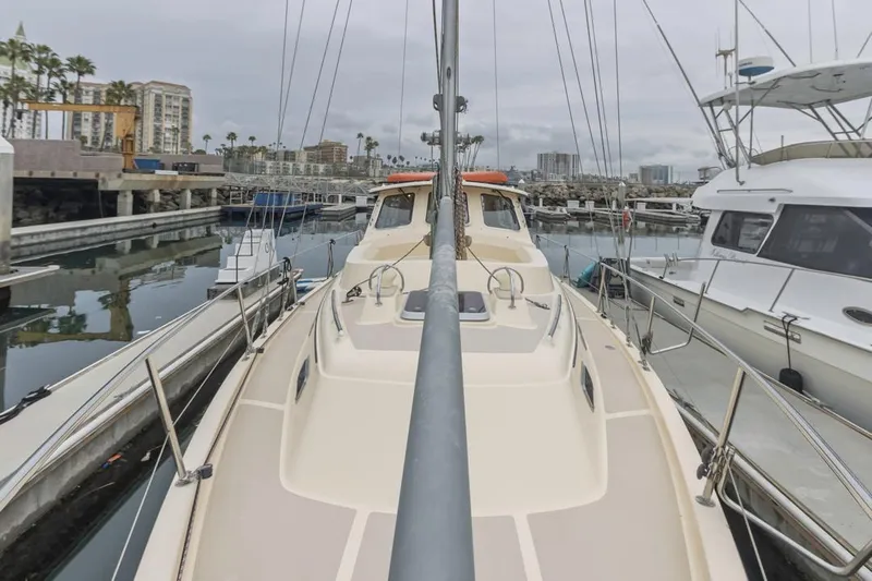 Seeker Yacht Photos Pics 2007 Island Packet SP Cruiser docked in a marina, surrounded by other boats.