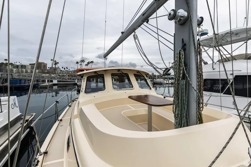 Seeker Yacht Photos Pics 2007 Island Packet SP Cruiser sailboat docked at marina, featuring spacious deck and cabin.