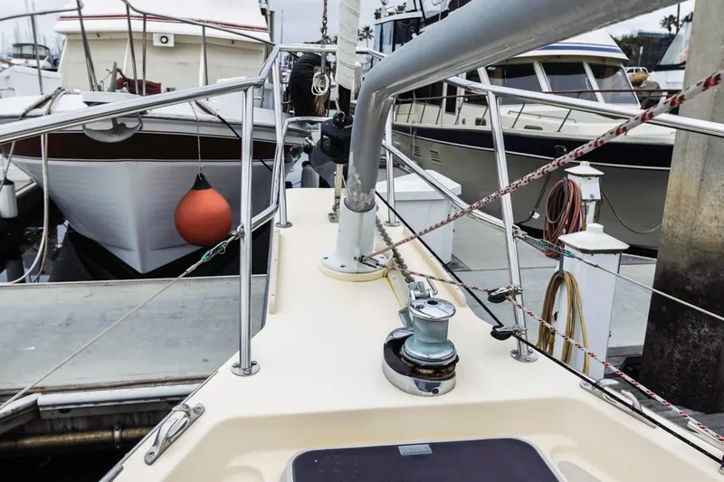 Seeker Yacht Photos Pics 2007 Island Packet SP Cruiser docked, showcasing deck and railing details.