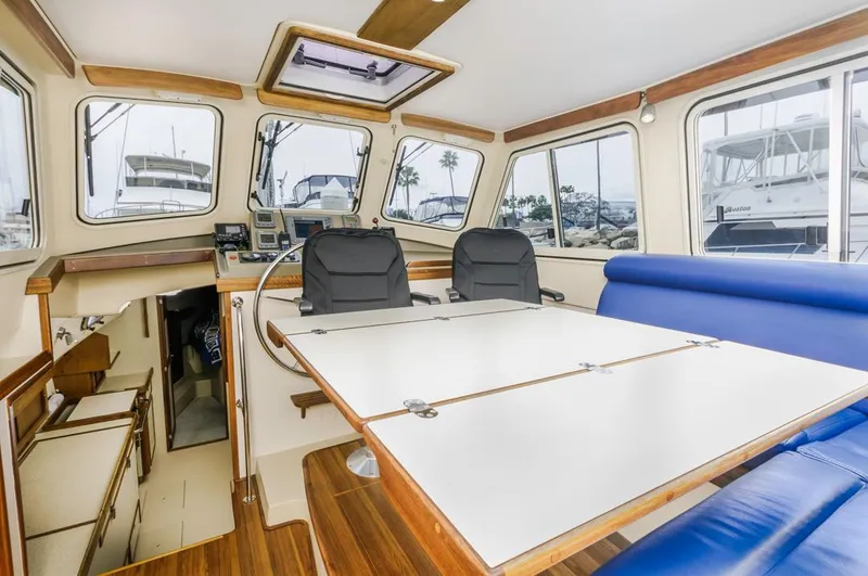 Seeker Yacht Photos Pics Interior of 2007 Island Packet SP Cruiser with spacious seating and navigation area.