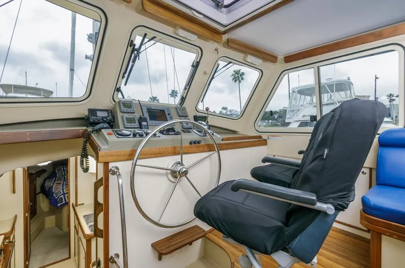 Seeker Yacht Photos Pics 2007 Island Packet SP Cruiser helm with navigation instruments and comfortable seating.