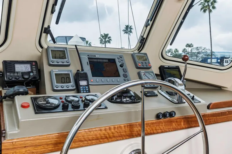 Seeker Yacht Photos Pics 2007 Island Packet SP Cruiser helm with navigation instruments and steering wheel.