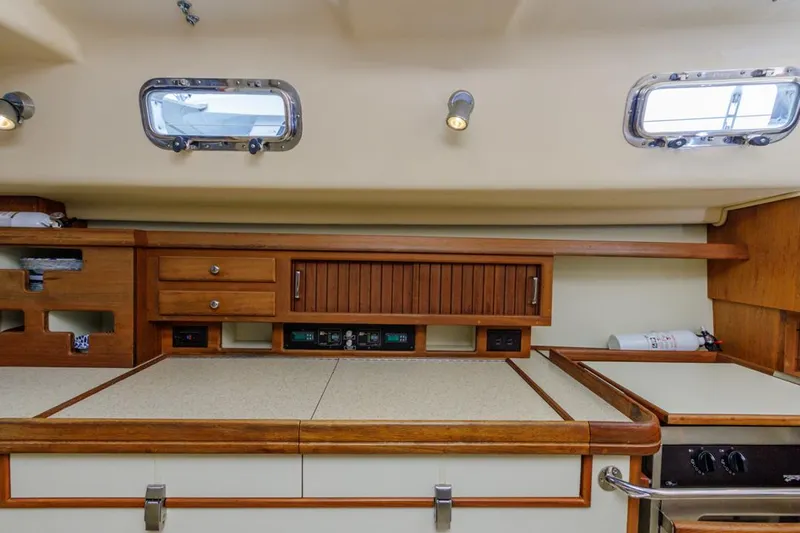 Seeker Yacht Photos Pics Interior of 2007 Island Packet SP Cruiser, featuring wooden cabinetry and countertops.