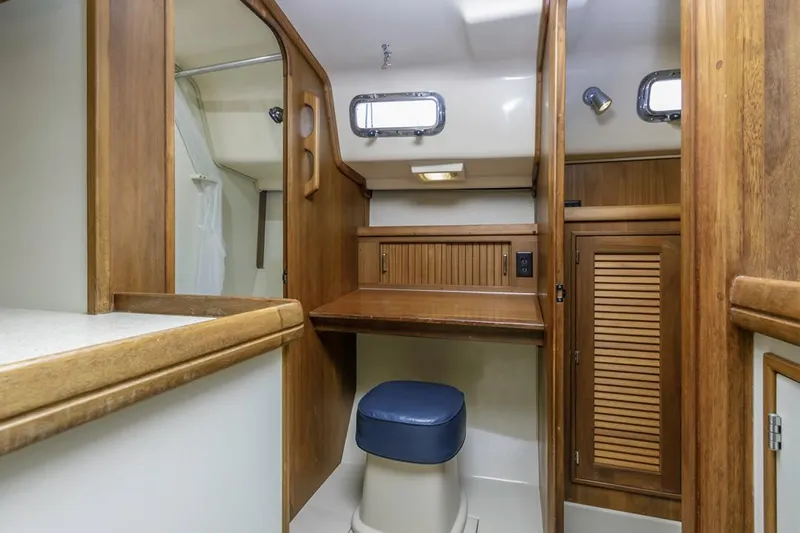 Seeker Yacht Photos Pics 2007 Island Packet SP Cruiser interior with wooden cabinetry and seating.