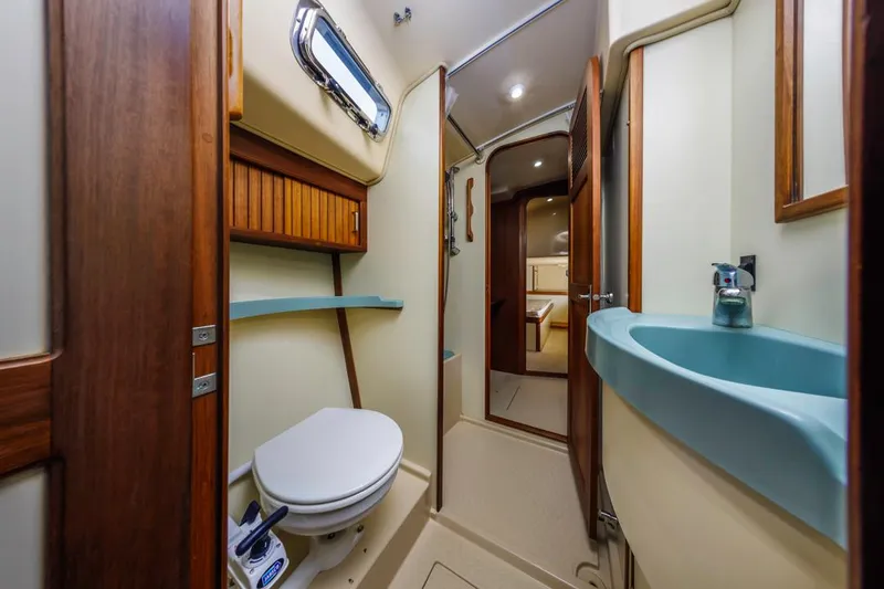 Seeker Yacht Photos Pics 2007 Island Packet SP Cruiser bathroom with modern fixtures and wood accents.