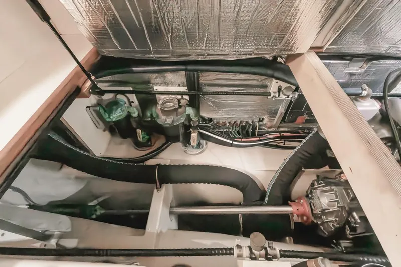 Seeker Yacht Photos Pics Engine compartment of 2007 Island Packet SP Cruiser, showcasing mechanical components and wiring.