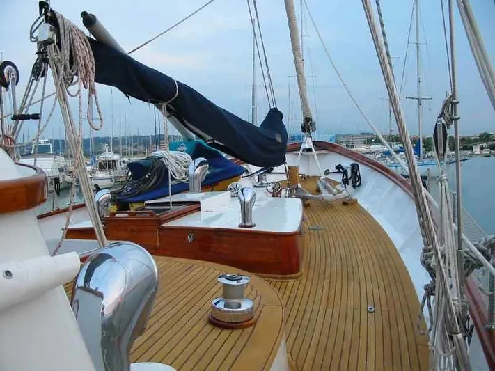 Sea Prince Yacht Photos Pics 1953 Abeking & Rasmussen Motor Sailer with wooden deck, docked at marina.