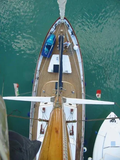 Sea Prince Yacht Photos Pics Aerial view of 1953 Abeking & Rasmussen Motor Sailer on turquoise water.