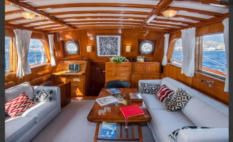 Sea Prince Yacht Photos Pics Luxurious 1953 Abeking & Rasmussen Motor Sailer interior with elegant wood finish and comfortable seating.