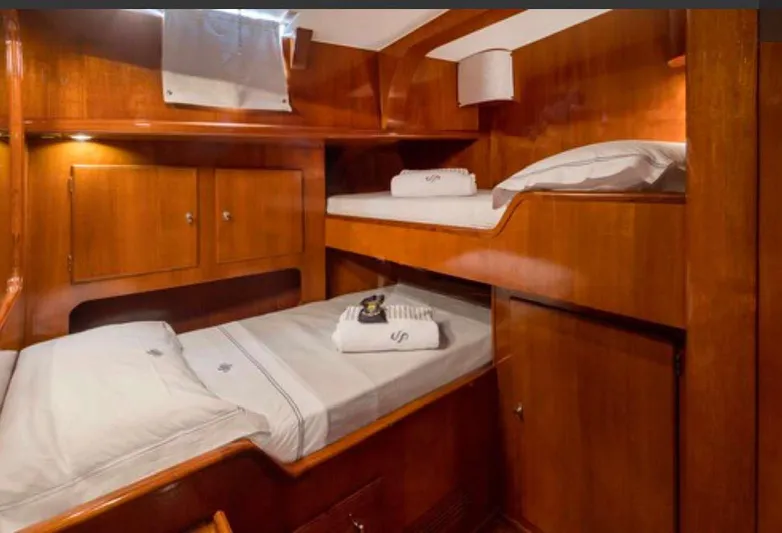 Sea Prince Yacht Photos Pics 1953 Abeking & Rasmussen Motor Sailer cabin with wooden interior and bunk beds.