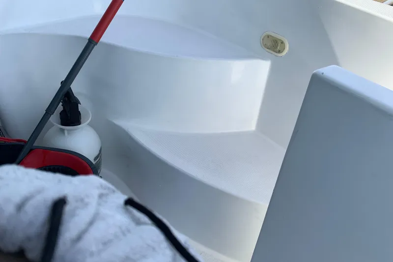  Yacht Photos Pics Staircase on 2004 Carver 570 Voyager Pilothouse yacht with cleaning supplies.