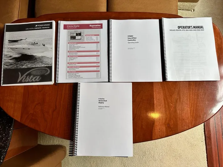  Yacht Photos Pics Manuals for 2007 Four Winns 378 Vista boat displayed on a wooden table.