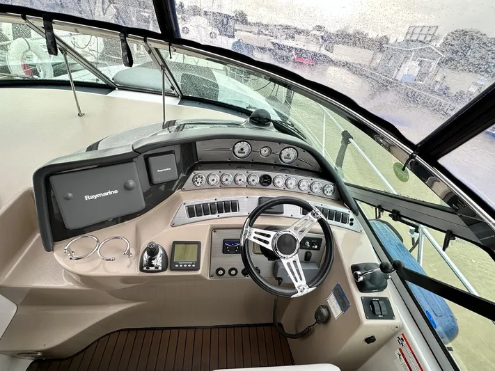  Yacht Photos Pics 2007 Four Winns 378 Vista boat dashboard with steering wheel and navigation controls.
