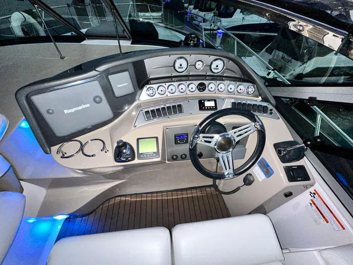  Yacht Photos Pics 2007 Four Winns 378 Vista boat dashboard with steering wheel and control panel.