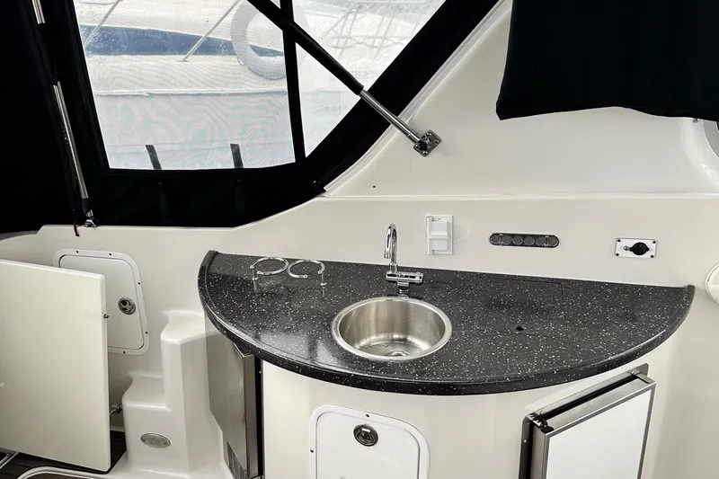  Yacht Photos Pics 2007 Four Winns 378 Vista yacht interior with sleek kitchenette and sink.